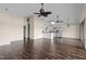 Open living room and kitchen with dark wood floors and ceiling fans at 148 Silver Lake Pt Pt, Sanford, NC 27332