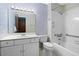 Clean bathroom with a shower/tub combo, toilet and vanity at 1605 Spring Dr, Garner, NC 27529