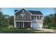 Two-story home with gray siding and stone accents at 169 St Andrews Dr, Zebulon, NC 27597