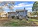 Two-story house with gray siding, deck, and pergola at 1706 Lisburn Ct, Garner, NC 27529