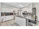 Modern kitchen with stainless steel appliances and island at 1706 Lisburn Ct, Garner, NC 27529