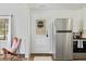 Modern kitchen with stainless steel refrigerator and white cabinetry at 1800 Rosewood Ave, Rocky Mount, NC 27801