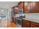 Modern kitchen with stainless steel appliances and granite countertops at 1807 Nellora Ln, Durham, NC 27703