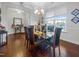 Formal dining room with hardwood floors, a glass table, and chandelier at 2019 Glenkirk Dr, Burlington, NC 27215