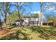 Spacious backyard with mature trees and a large grassy area at 203 Hillside Dr, Smithfield, NC 27577