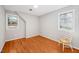 Simple bedroom with hardwood floors and neutral walls at 203 Hillside Dr, Smithfield, NC 27577