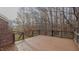 Wooden deck overlooking a wooded backyard at 208 Mallard Creek Dr # B, Graham, NC 27253