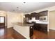 Modern kitchen featuring dark cabinetry and granite island at 219 Rosedale Creek Dr, Durham, NC 27703