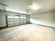 Spacious two-car garage with finished flooring and an automatic opener at 237 Hopewell Branch Ct, Smithfield, NC 27577