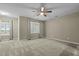 Bright bedroom with two windows and ceiling fan at 240 Wood Run, Sanford, NC 27332