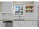 White shaker cabinets, granite countertops, and a farmhouse sink at 240 Wood Run, Sanford, NC 27332