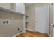 Laundry room with built-in shelving and a door to the outside at 240 Wood Run, Sanford, NC 27332