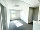 Bright bedroom with carpet flooring, window, and double doors to closet at 251 Hopewell Branch Ct, Smithfield, NC 27577