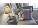 Cozy corner with a chair, lamp, and decorative pillows at 2543 Lily Dr # 189, Haw River, NC 27258