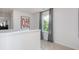 Upstairs hallway with window, gray curtains, and geometric art at 2547 Lily Dr # 191, Haw River, NC 27258