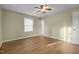 Bright bedroom with wood-look floors and ceiling fan at 3064 Carolina Way, Sanford, NC 27332