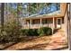 Front view of brick house with porch and walkway at 3064 Carolina Way, Sanford, NC 27332