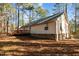 Back of house showing siding, deck, and yard at 3064 Carolina Way, Sanford, NC 27332