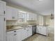 Kitchen features granite countertops, white cabinets, and stainless steel appliances at 3064 Carolina Way, Sanford, NC 27332
