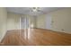 Hardwood floor living room with door and sliding glass door at 3064 Carolina Way, Sanford, NC 27332
