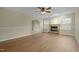 Living room with fireplace, hardwood floors and ceiling fan at 3064 Carolina Way, Sanford, NC 27332