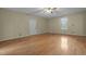 Spacious living room featuring hardwood floors and a ceiling fan at 3064 Carolina Way, Sanford, NC 27332