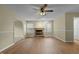 Living room with fireplace, hardwood floors and ceiling fan at 3064 Carolina Way, Sanford, NC 27332