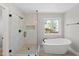 Spa-like bathroom with a large walk-in shower and a free-standing tub at 3128 Gold Dust Ln, Willow Springs, NC 27592