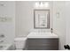 Clean bathroom with single vanity and white subway tile at 3128 Gold Dust Ln, Willow Springs, NC 27592