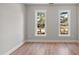 Spacious bedroom with hardwood floors and large windows at 3128 Gold Dust Ln, Willow Springs, NC 27592