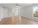 Bright bedroom featuring hardwood floors and an ensuite bathroom at 3128 Gold Dust Ln, Willow Springs, NC 27592