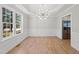 Dining room with hardwood floors, chandelier, and wainscoting at 3128 Gold Dust Ln, Willow Springs, NC 27592