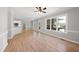 Open living room and kitchen with hardwood floors and lots of natural light at 3128 Gold Dust Ln, Willow Springs, NC 27592