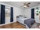 Cozy bedroom with blue curtains and a comfortable bed at 3210 Courtney Ln, Sanford, NC 27330