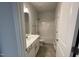 Clean bathroom with a bathtub and white vanity at 37 Streamline Ct, Lillington, NC 27546