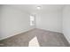 Small bedroom with gray carpet, a window, and a door at 3708 Watson Ridge Ln # Leighton, Raleigh, NC 27616