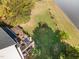 Elevated view of backyard oasis with deck, gazebo, and lush landscaping at 400 Challenge Rd, Raleigh, NC 27603