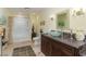 Modern bathroom with a glass sink, tiled floor, and a shower/tub combo at 400 Challenge Rd, Raleigh, NC 27603