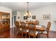 Formal dining room with hardwood floors, a large table and sideboard at 400 Challenge Rd, Raleigh, NC 27603