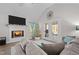 Bright living room featuring a fireplace and patio doors at 50 Timber Ct, Spring Hope, NC 27882