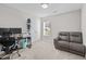 Home office features a gray recliner, desk, and window at 50 Timber Ct, Spring Hope, NC 27882