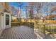 Deck overlooking fenced backyard with mature trees at 604 Kingswood Dr, Cary, NC 27513