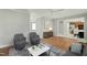 Open living room with view of kitchen and hardwood floors at 604 Kingswood Dr, Cary, NC 27513