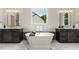 Double vanity bathroom with soaking tub and walk-in shower at 613 Darian Woods, Holly Springs, NC 27540