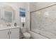 Modern bathroom with a shower/tub combo, white cabinets, and marble flooring at 613 Darian Woods, Holly Springs, NC 27540