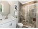 Bathroom with shower, single vanity, and modern fixtures at 613 Darian Woods, Holly Springs, NC 27540
