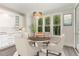 Bright kitchen features a breakfast nook, white cabinetry, and modern appliances at 613 Darian Woods, Holly Springs, NC 27540