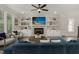 Living room with fireplace, built-in shelving, and comfy seating at 613 Darian Woods, Holly Springs, NC 27540