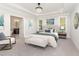 Main bedroom features a king bed, ensuite bathroom, and plenty of natural light at 613 Darian Woods, Holly Springs, NC 27540
