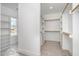 Large walk-in closet with ample shelving and hanging space at 613 Darian Woods, Holly Springs, NC 27540